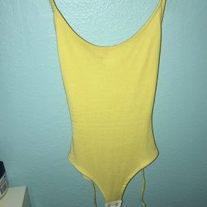 yellow body suit with back showing